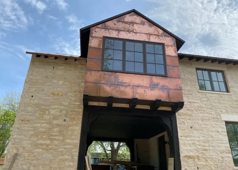 Copper metal panel facade on a stone building for Metal Roof Coating in Vero Beach