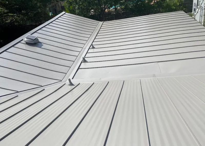 Solar attic fan installed on a metal roof for Roof Ventilation in Vero Beach